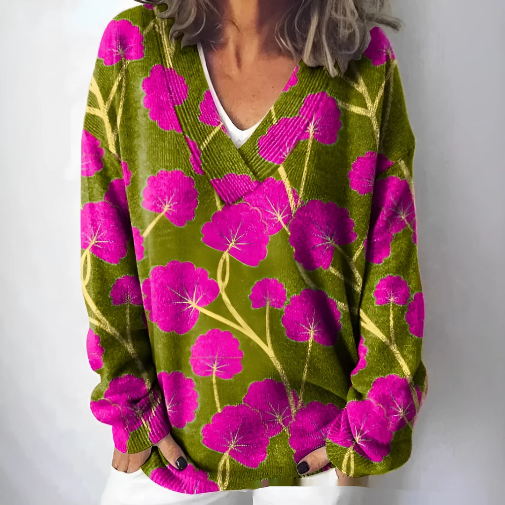 Women's white floral print V-neck sweatshirt with 3D pattern and long sleeves on a hanger.