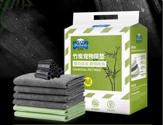 Pack of thickened dog urine pads showing size comparison between S, M, L and XL options