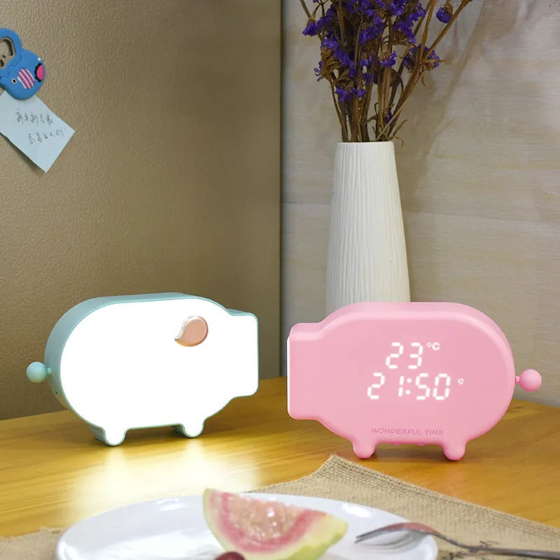 Multifunctional LED alarm clock with temperature display and USB port in blue or pink ABS plastic