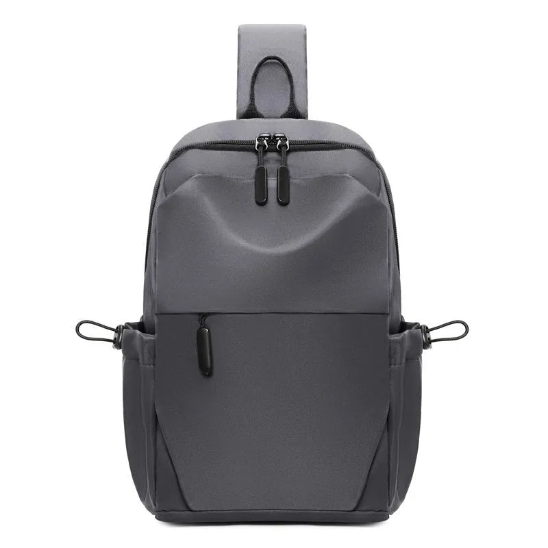 Men's grey lightweight chest bag with large main compartment and shoulder strap.