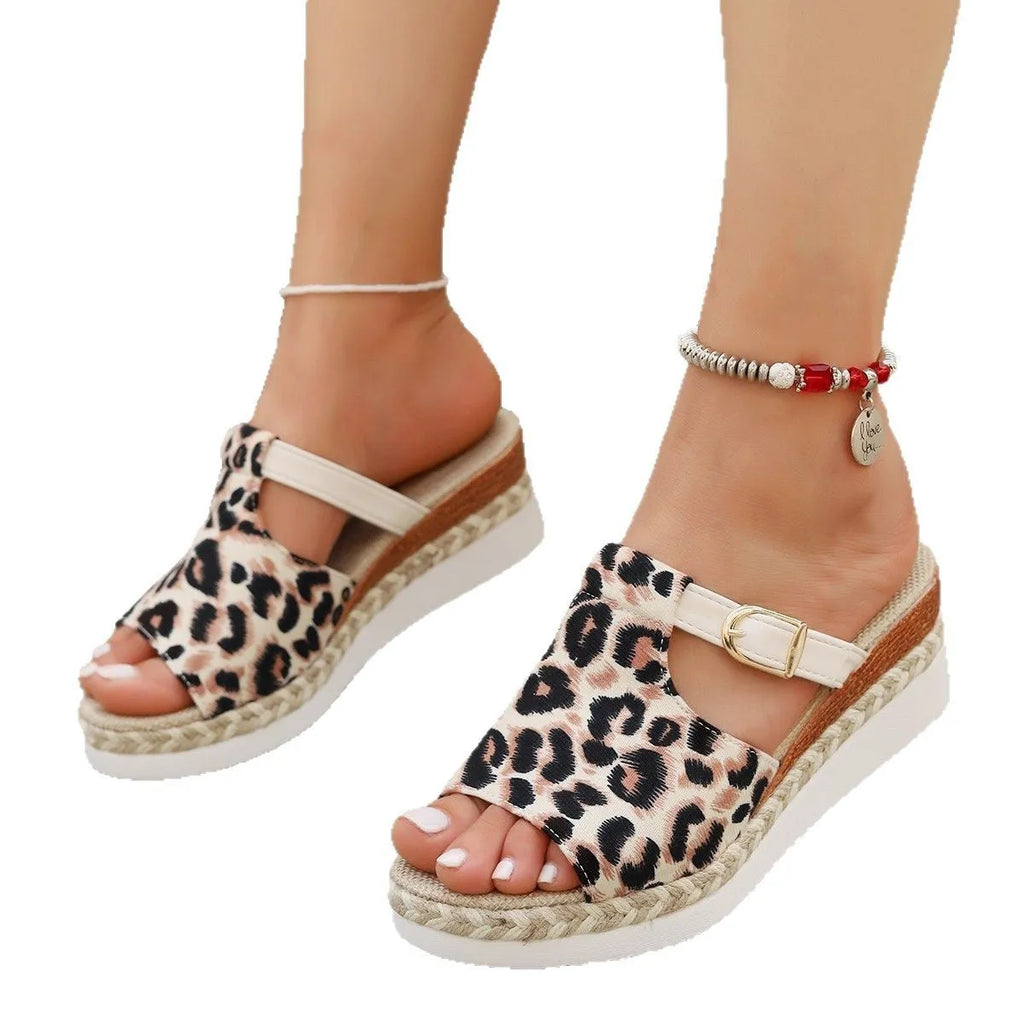 Leopard print women's platform sandals with a wedge sole and fish-mouth toe.