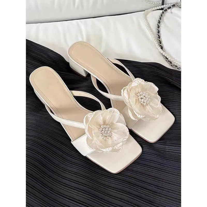 Women's chunky heel square toe sandals with satin upper and flower detail in cream-white