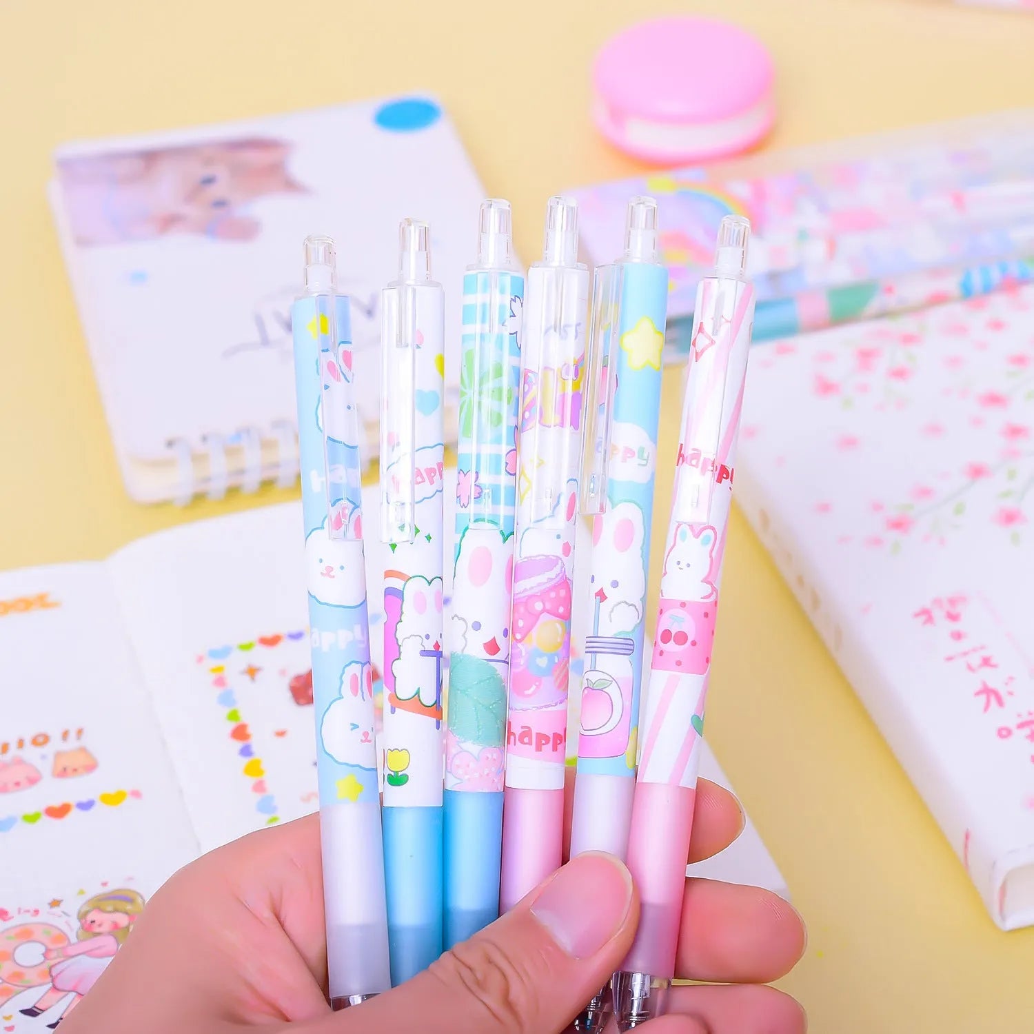 Six cartoon bunny design black ink pens with 0.5mm tips arranged together