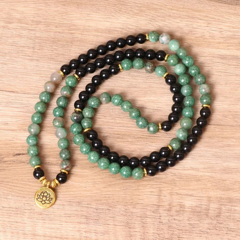 Green and black elastic beaded alloy bracelet with natural styling