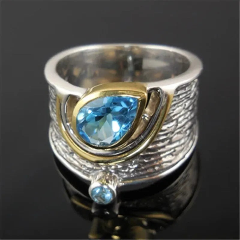 Chinese style women's blue zircon ring with drop shape design and inlaid detailing