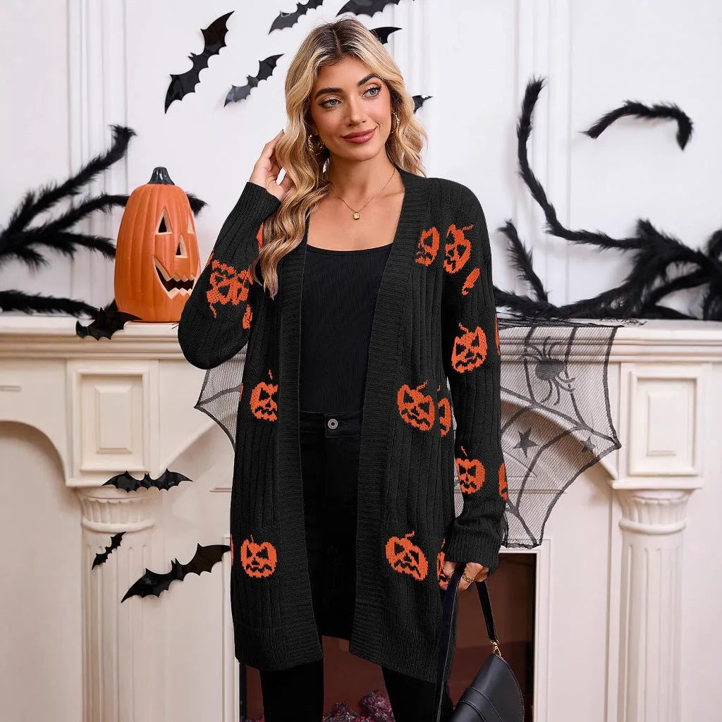 Women's black knitted cardigan with an orange pumpkin head jacquard pattern and regular sleeves.
