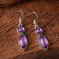 Black and purple geometric pendant earrings with round elements in vintage bohemian style