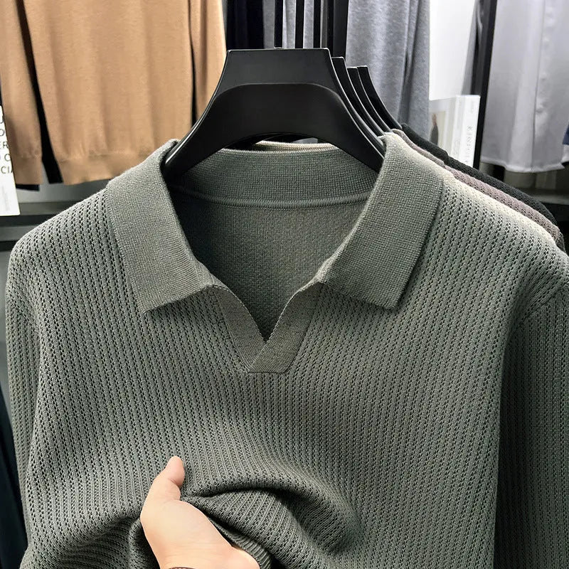 Man wearing a loose-fit green casual pullover sweater for autumn leisure.