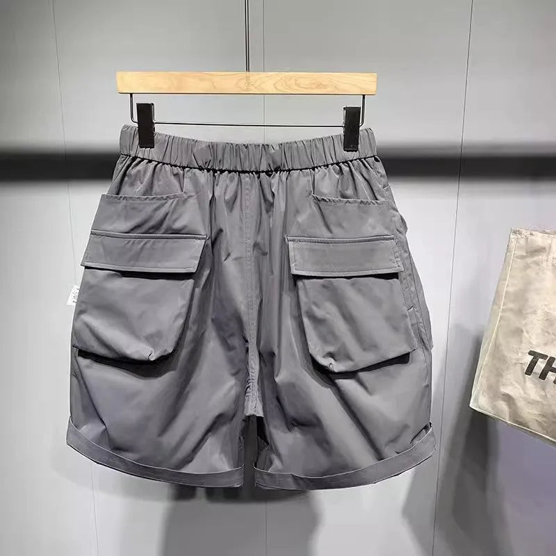 Men's black loose fitting work shorts with multiple pockets and straight leg hem