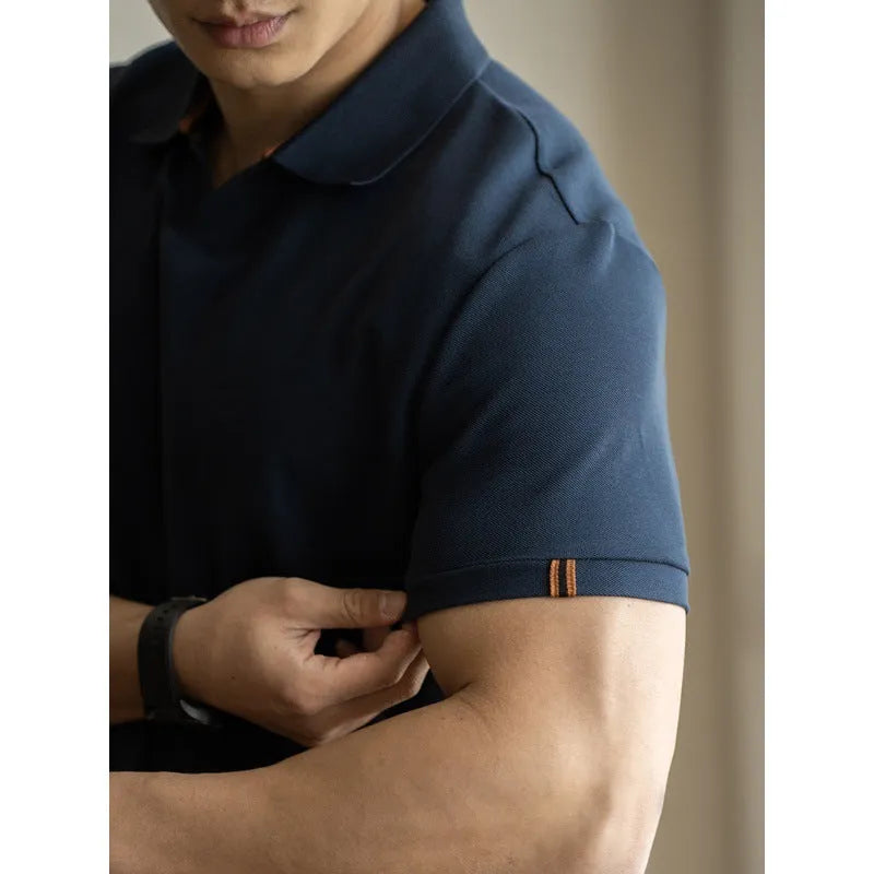 Blue short-sleeved cotton blend polo shirt for men on a hanger, showing regular fit and button placket.