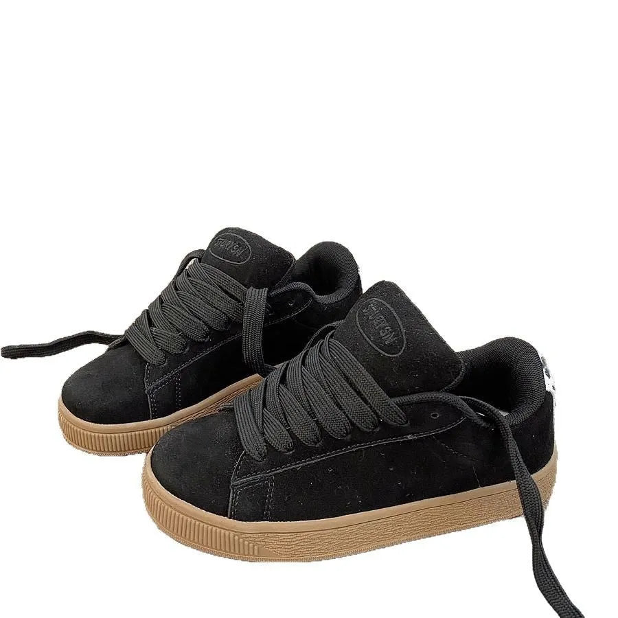Black retro-style low-top lace-up sneakers with a round toe and waterproof platform sole.