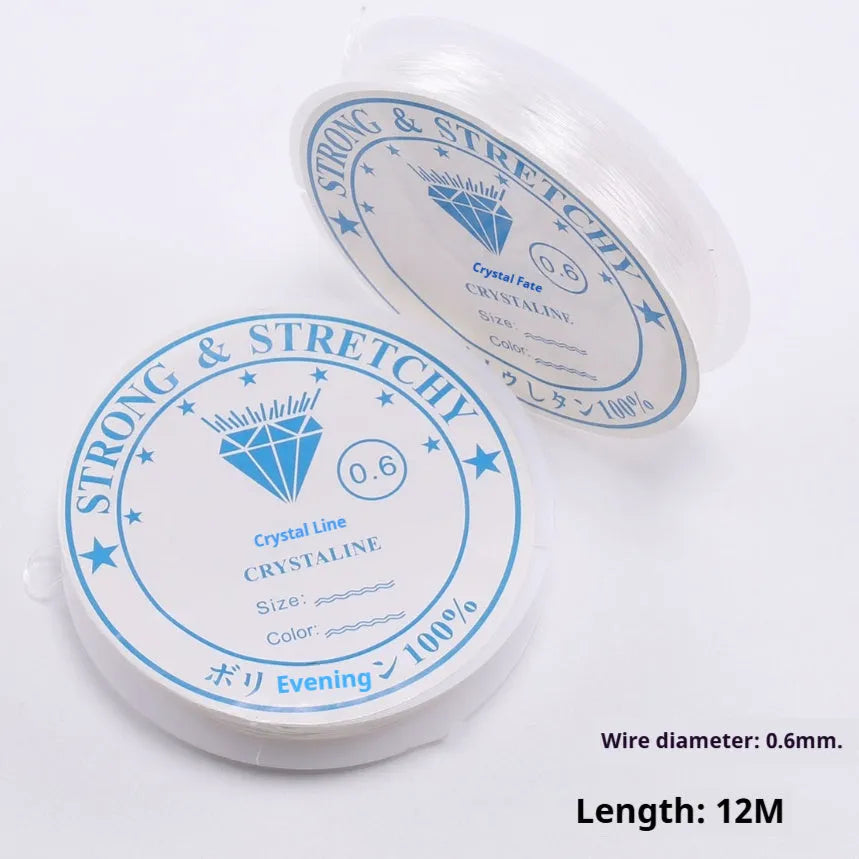 Clear white elastic fishing line reel for DIY jewellery making, showing transparent cord.