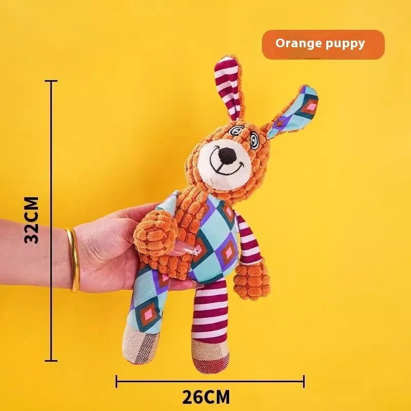 Assorted plush pet chew toys including a blue elephant, a duck, and a donkey in different colours
