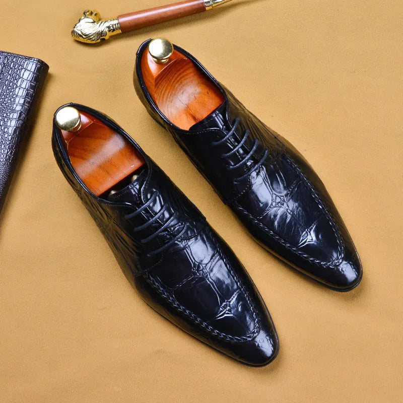 Men's brown leather loafers with a silver horse bit buckle on a rubber sole.