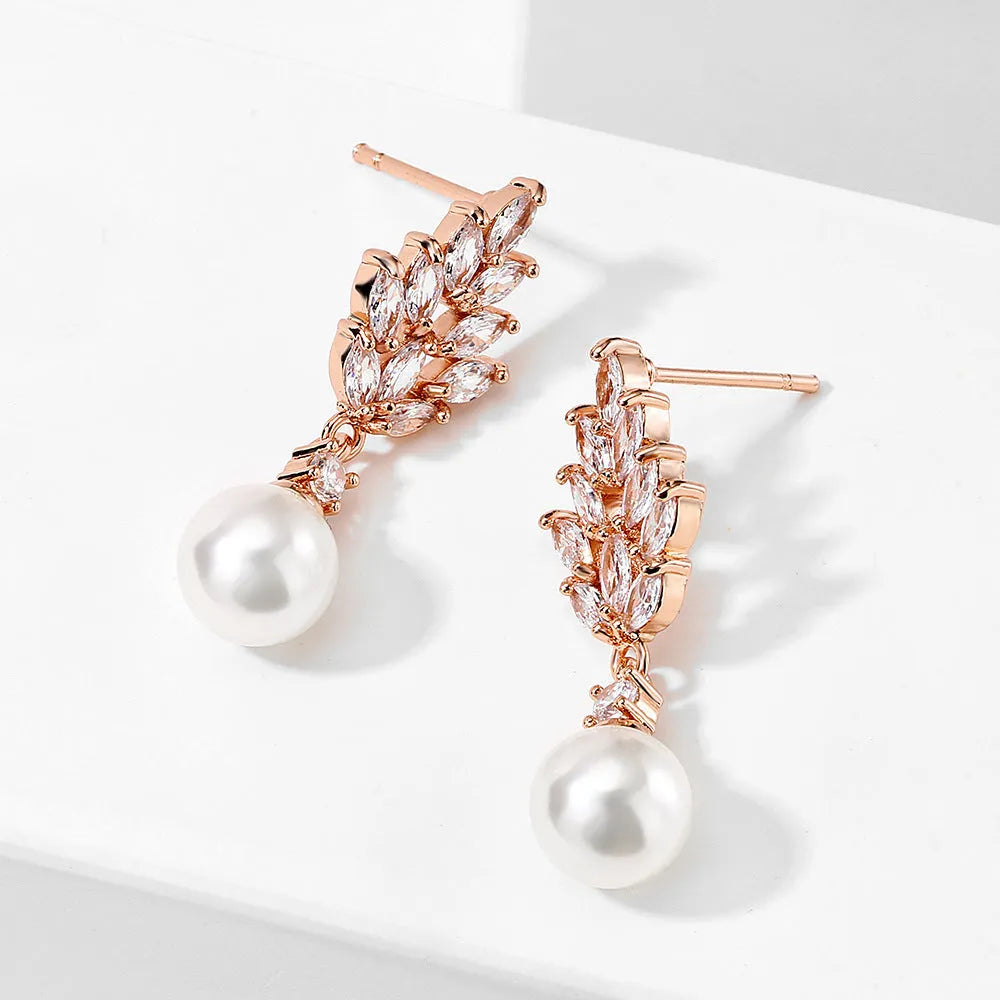 Geometric stud earrings with micro inlaid zircon detailing and floral design in gold, platinum, or rose gold plating