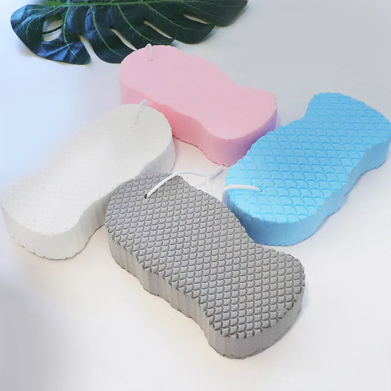 3D fish scale pattern bath sponge in white, grey, pink, or light blue colours for gentle body exfoliation