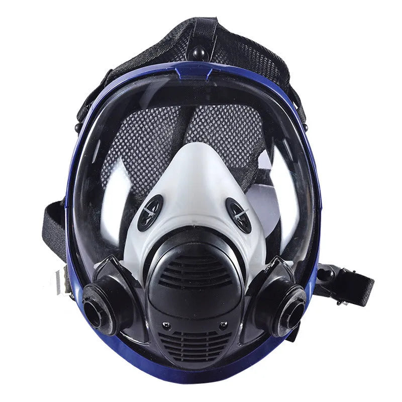 Blue edge spherical full face gas mask with trapezoidal canister on a grey background.