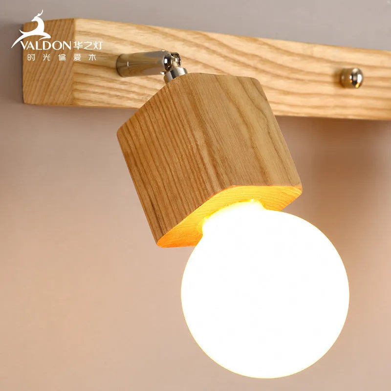 Single-head circular LED wall lamp with a 24cm diameter, mounted on a plain wall.