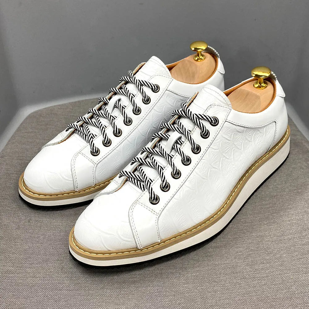 Men's low-top shoes with a handmade embossed pattern on the upper and front lace closure.