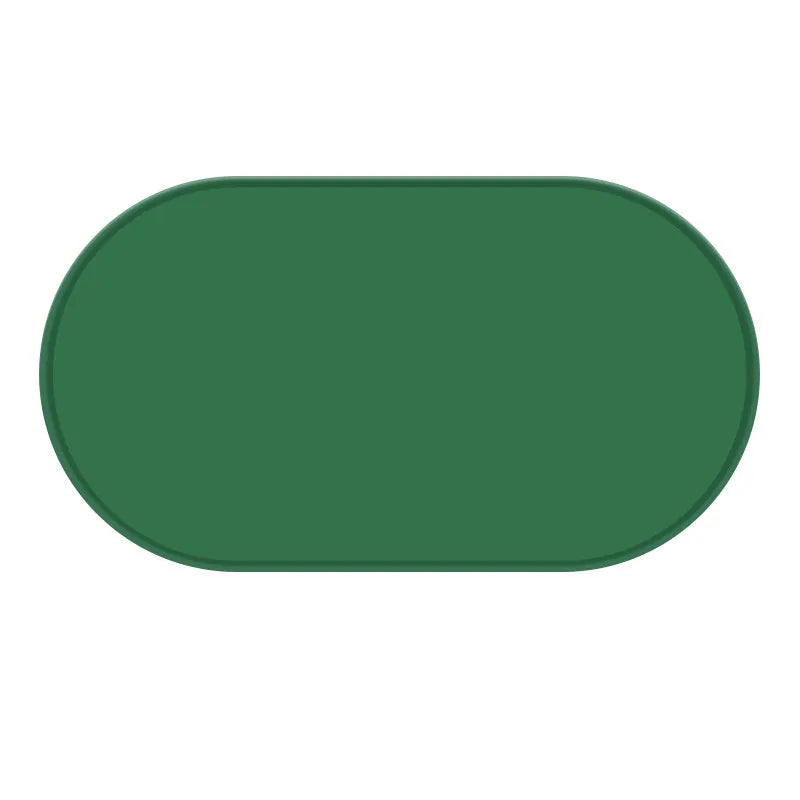 Green silicone waterproof pet feeding placemat with a food bowl on it.