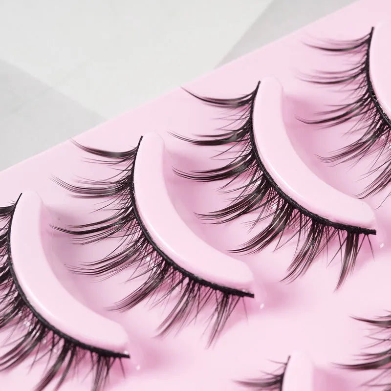 Five pairs of natural wispy false eyelashes on a card for manga anime cosplay and Korean style makeup.