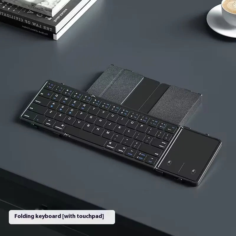Black folding Bluetooth keyboard for mobile phones and tablets showing compact 346mm size