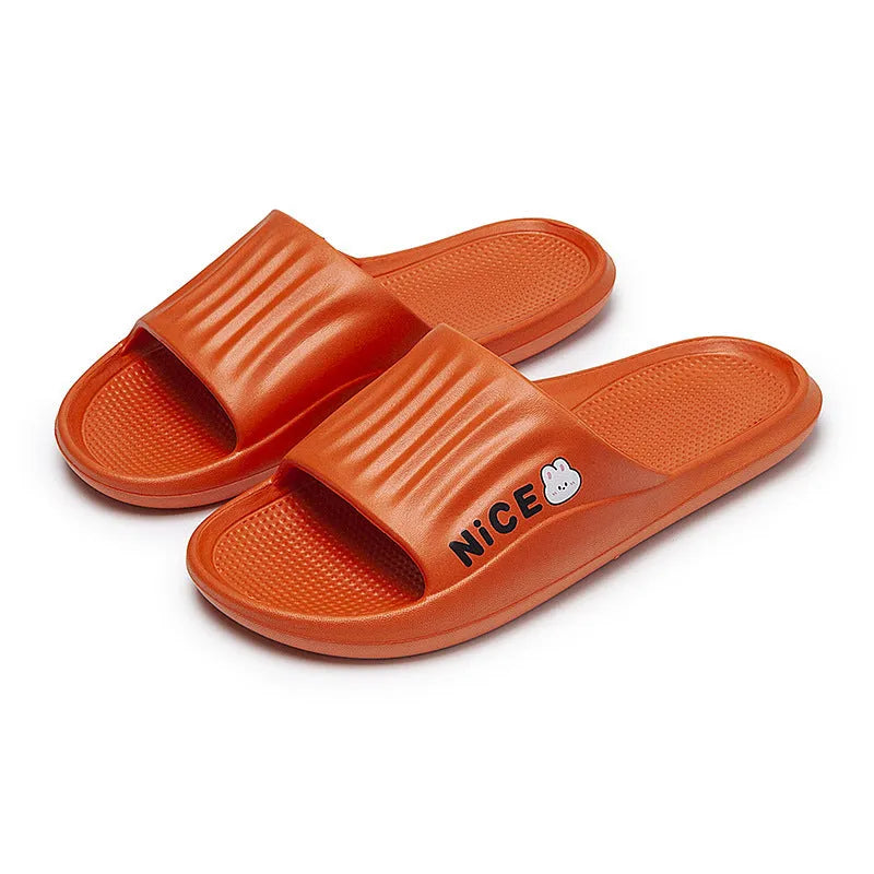 Pair of minimalist EVA flip flop slippers in a choice of six colours, showing the injection moulded non-slip sole.