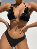 Black gathered swimwear set with matching top and shorts in European sizing