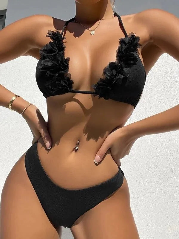 Black gathered swimwear set with matching top and shorts in European sizing