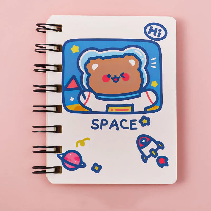 Astronaut-themed pocket notebook with flip closure showing 10.5 × 8 cm dimensions
