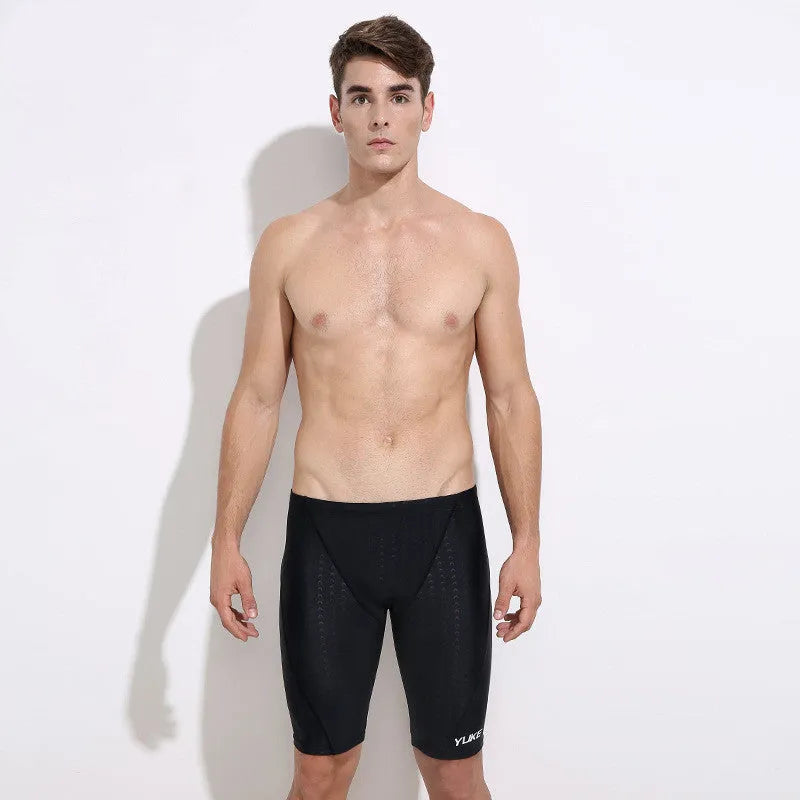 Men's black 5-piece swimming set including trunks, goggles, cap, ear plugs with nose clip, and carrying bag.
