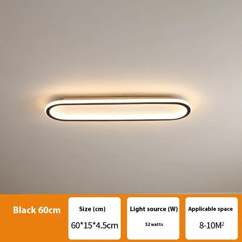 Minimalist black strip ceiling lamp with PVC shade mounted on a white ceiling