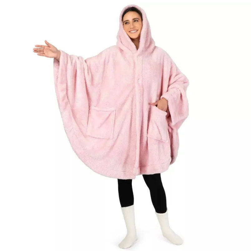 Thick hooded long sleeve bathrobe in black hanging on a hook