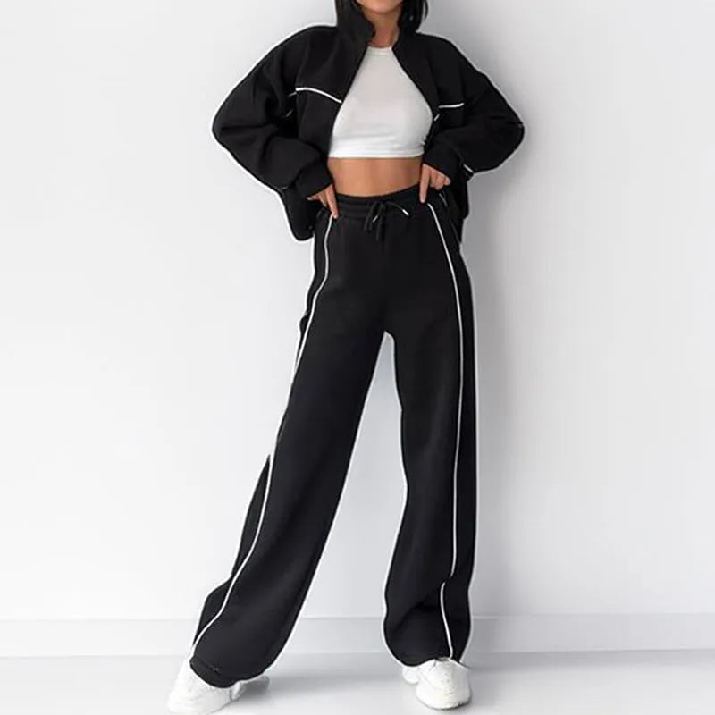 Casual two-piece suit set with a grey hoodie and striped lace-up trousers on a hanger