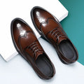Men's black brogue leather shoes with traditional perforated detailing and lace-up design