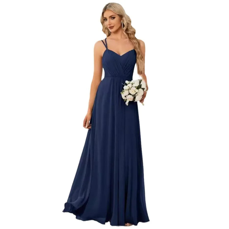 Women's long pleated sleeveless A-line dress in light green, shown on a mannequin.