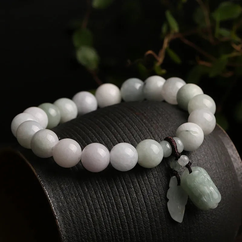 Natural jade geometric bracelet with hanging charm showing Apple design option