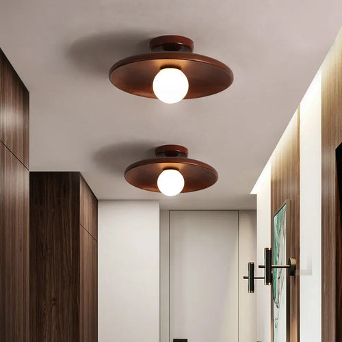 Modern solid wood and glass ceiling lamp in walnut colour showing three size options.