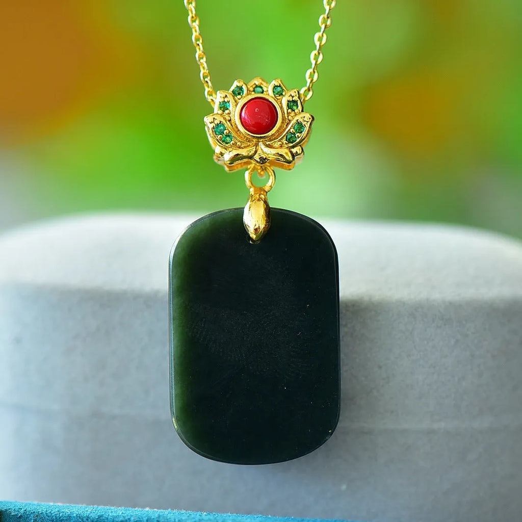 Flat copper inlaid pendant with natural ink blue Hetian jade stone on a necklace.