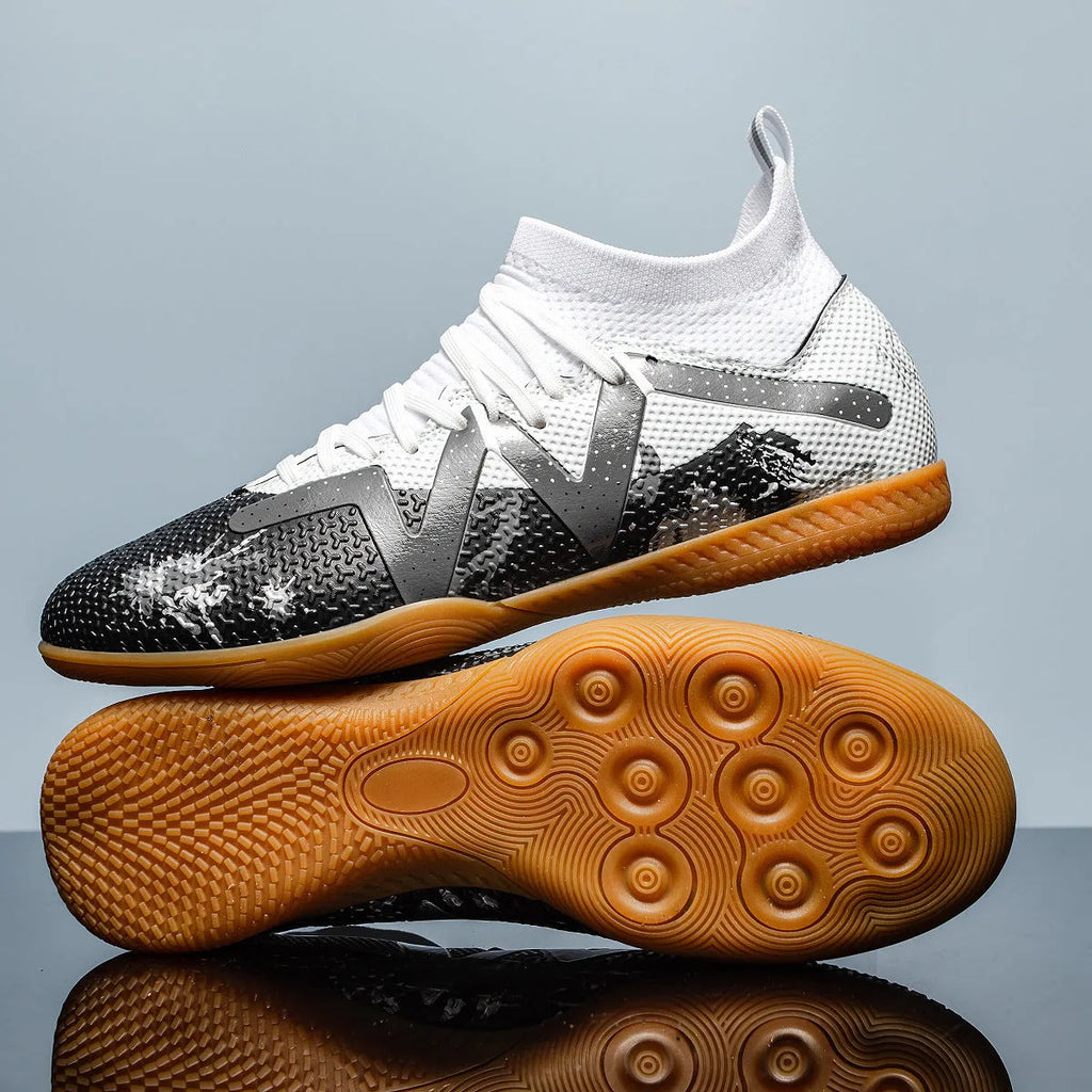 Low-top football shoes with studded rubber outsoles in black and yellow colour combination