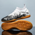 Low-top football shoes with studded rubber outsoles in black and yellow colour combination