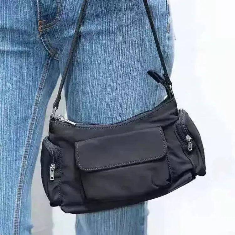 Black PU lightweight shoulder bag with two pockets and side line detail