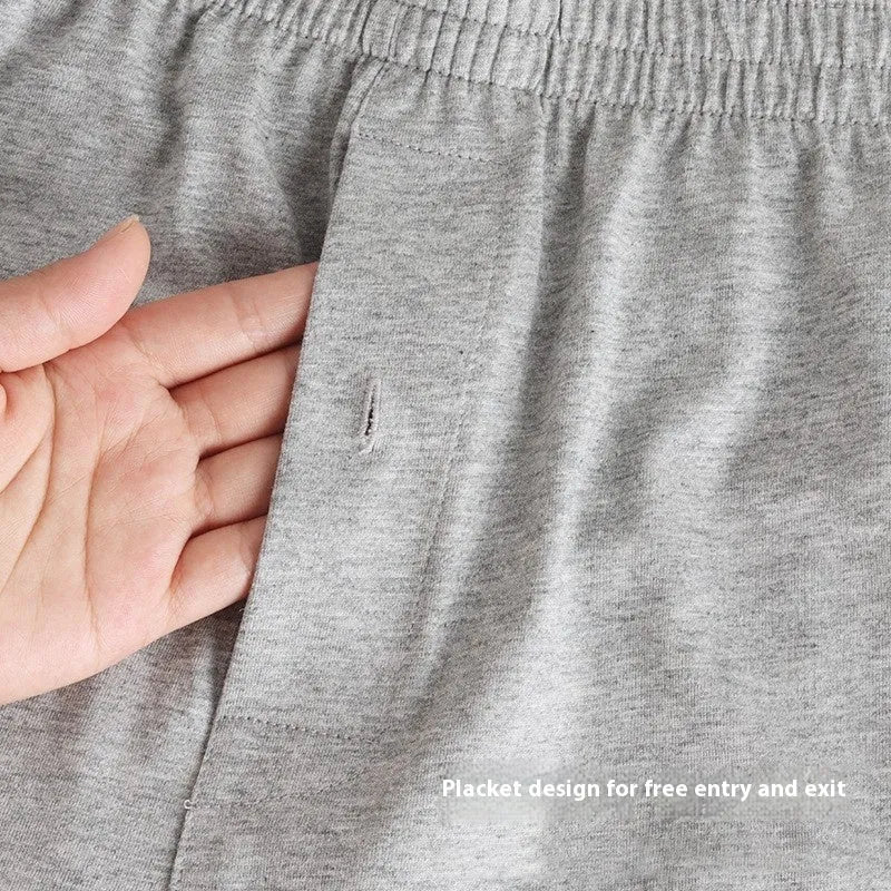 Men's solid colour loose-fit cotton boxer shorts on a white background, showing high waist and leg openings.