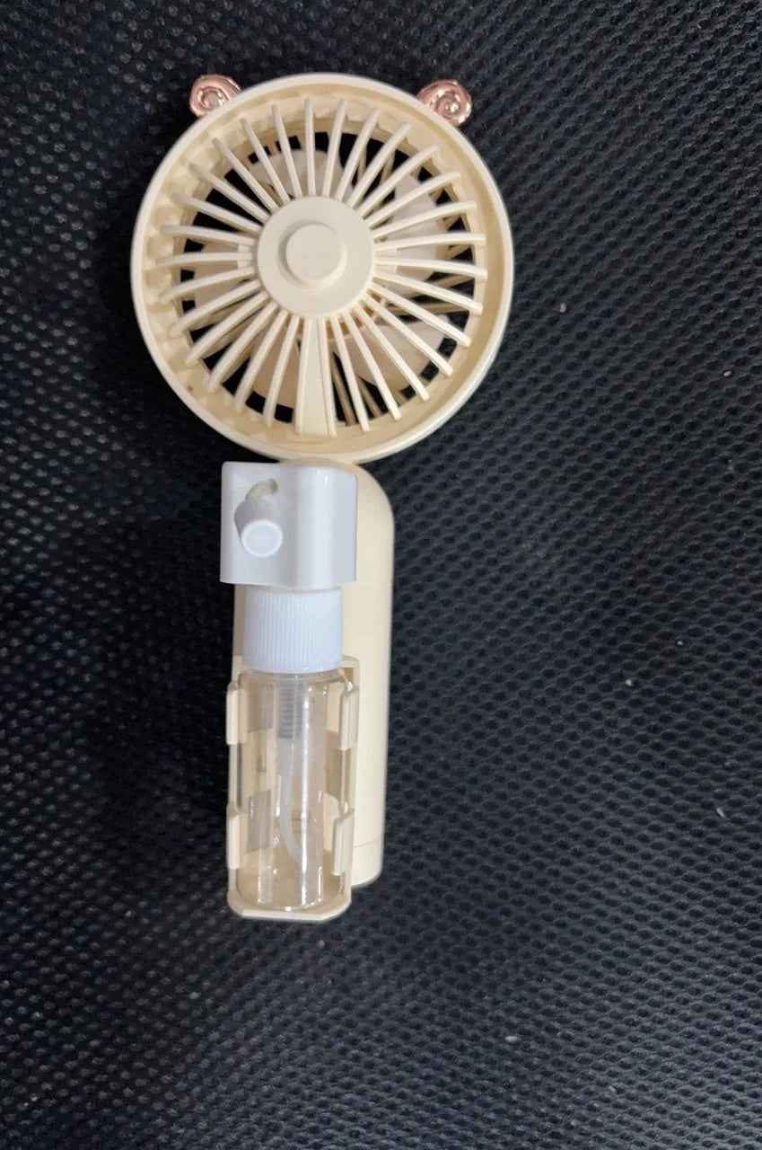 USB-powered personal handheld fan in apricot colour with plastic nozzle