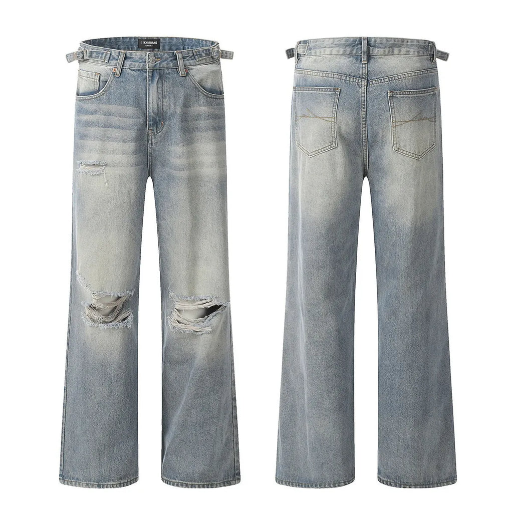 Blue wash straight-leg jeans with ripped detailing and zipper fly opening