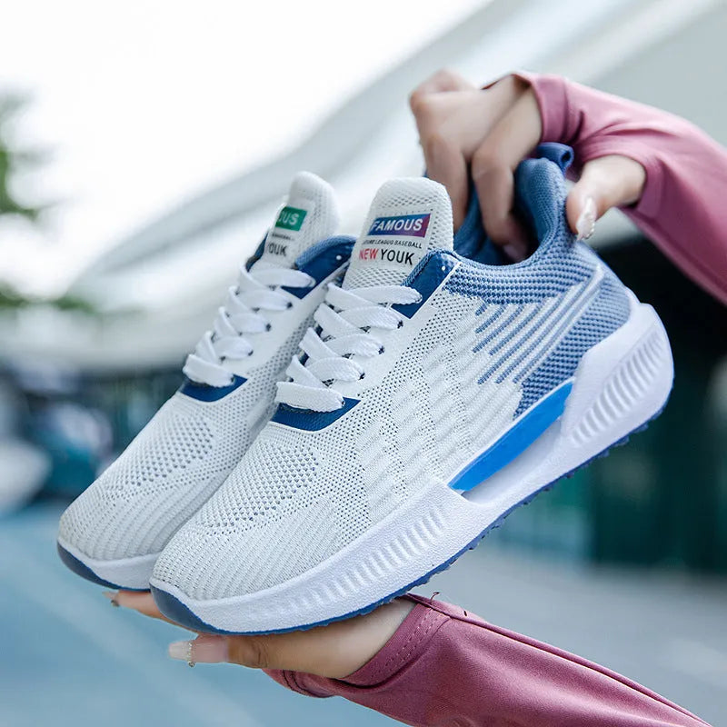 Men's blue casual mesh sports shoes with a round toe and cloth upper on a white background.
