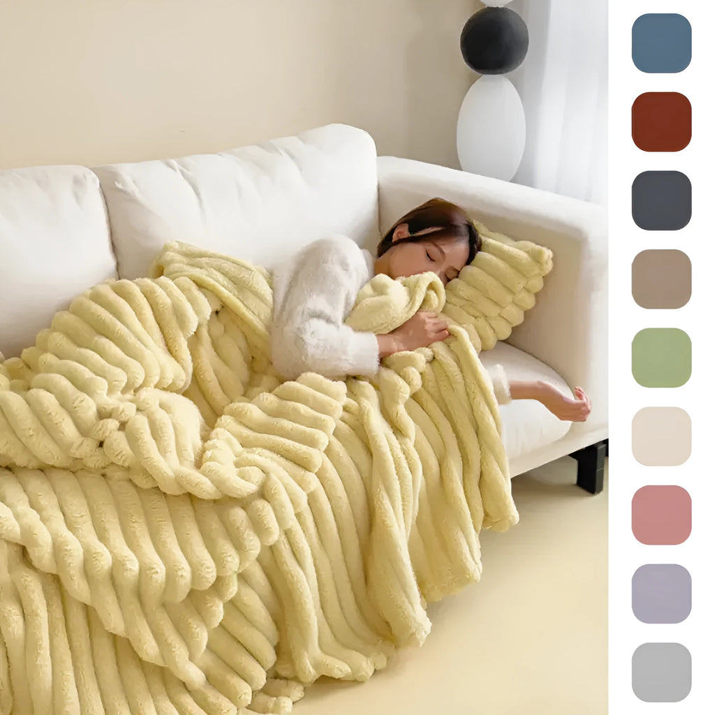 Soft Wind double-sided thickening bubble velvet blanket in a solid colour shown on a sofa.