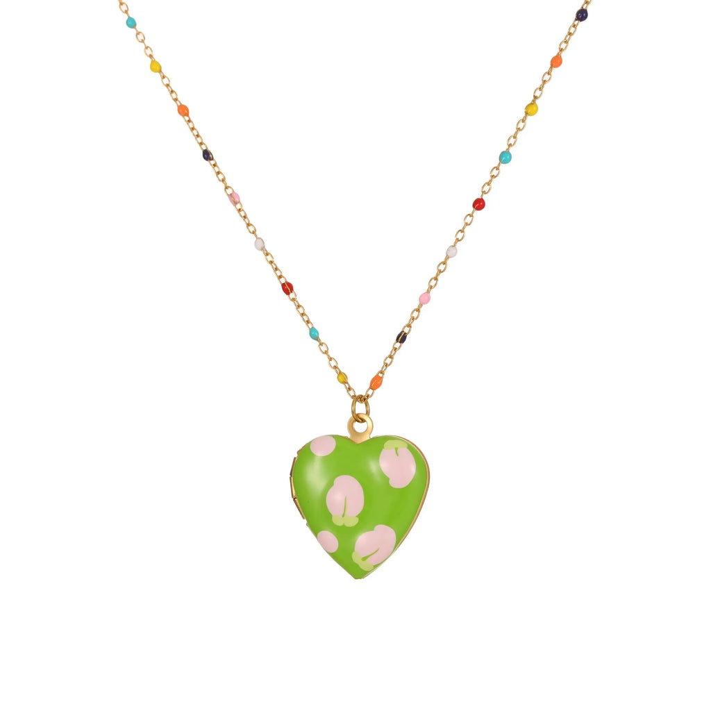 Women's stainless steel necklace with gold plating showing heart-shaped fruit pendant design on adjustable chain
