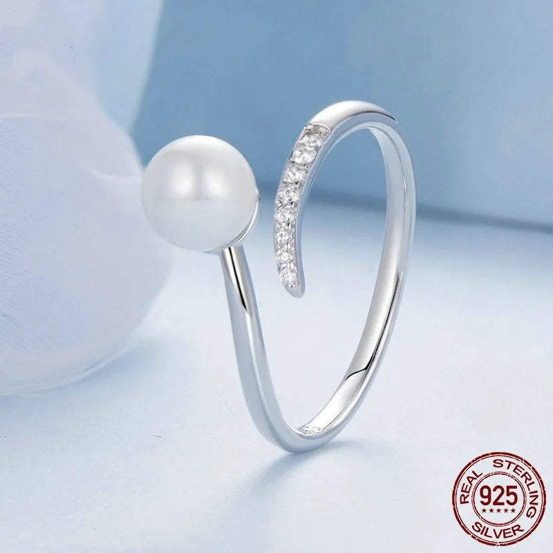 Women's S925 sterling silver adjustable ring with pearl detail and open loop design