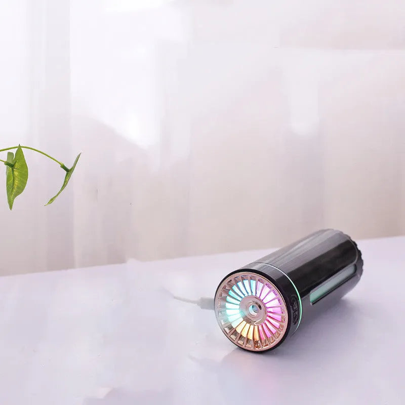 Black portable USB rechargeable humidifier with colourful LED lights and compact design for car or desktop use